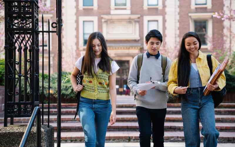 Modern university campus in Singapore with students walking