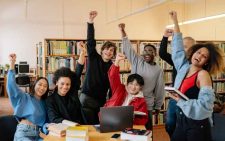Teacher explaining AS Level concepts to students during a classroom session