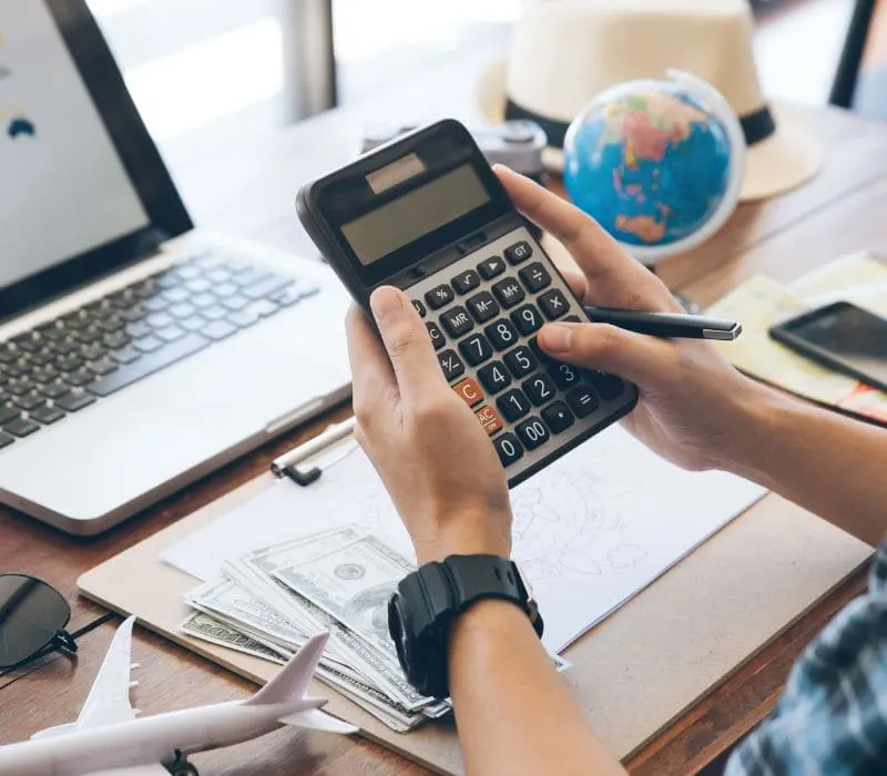 IB student using a scientific calculator during online tutoring