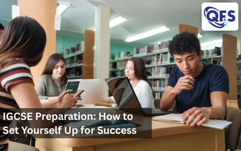 Students studying at desk with books and notes — IGCSE preparation in progress