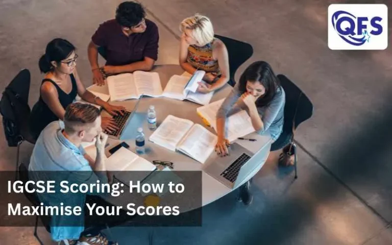 Students studying for IGCSE exam with books and laptop