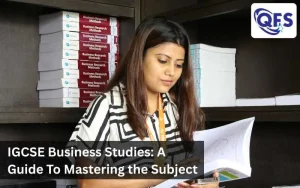 Students preparing for IGCSE Business Studies with notes and textbooks